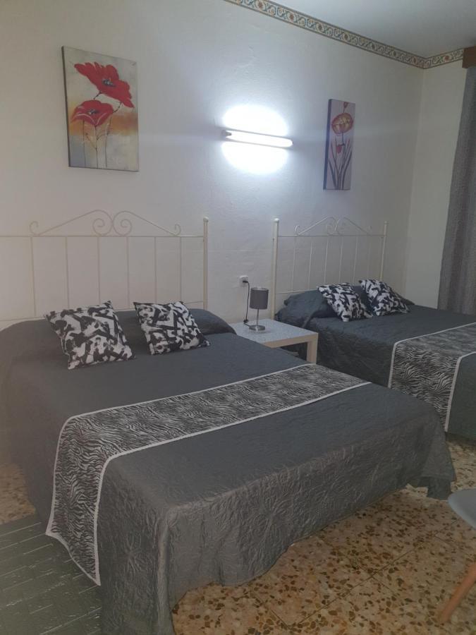 Habitación Cuádruple con balcón y baño compartido