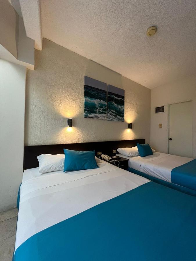 Habitación Doble con 2 camas dobles y vistas al océano - no fumadores