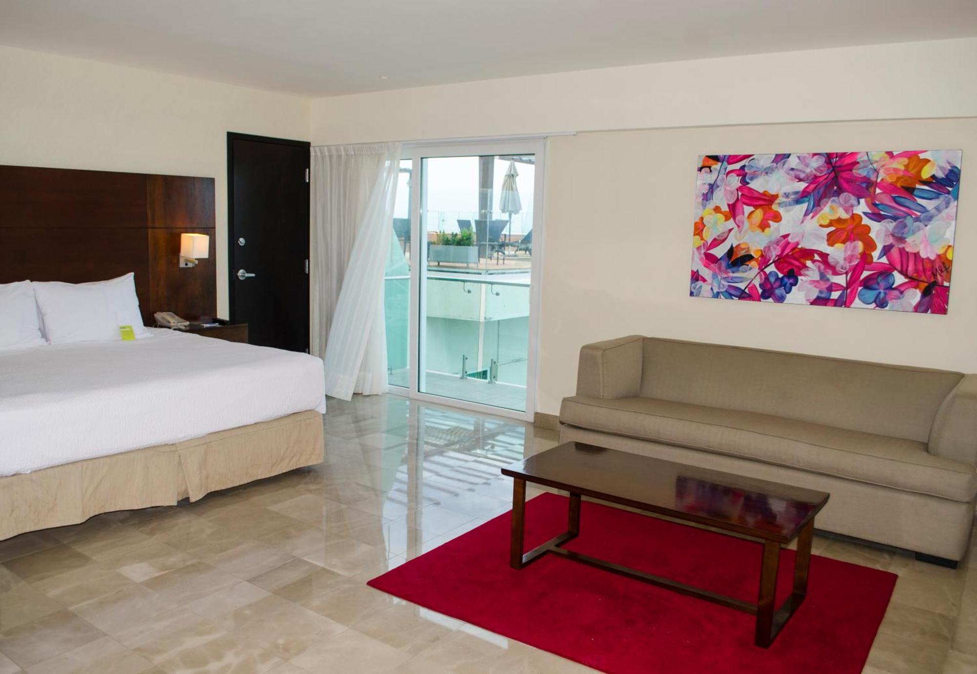 Suite Master con balcón y vistas parciales al océano - 1 cama extragrande y sofá cama