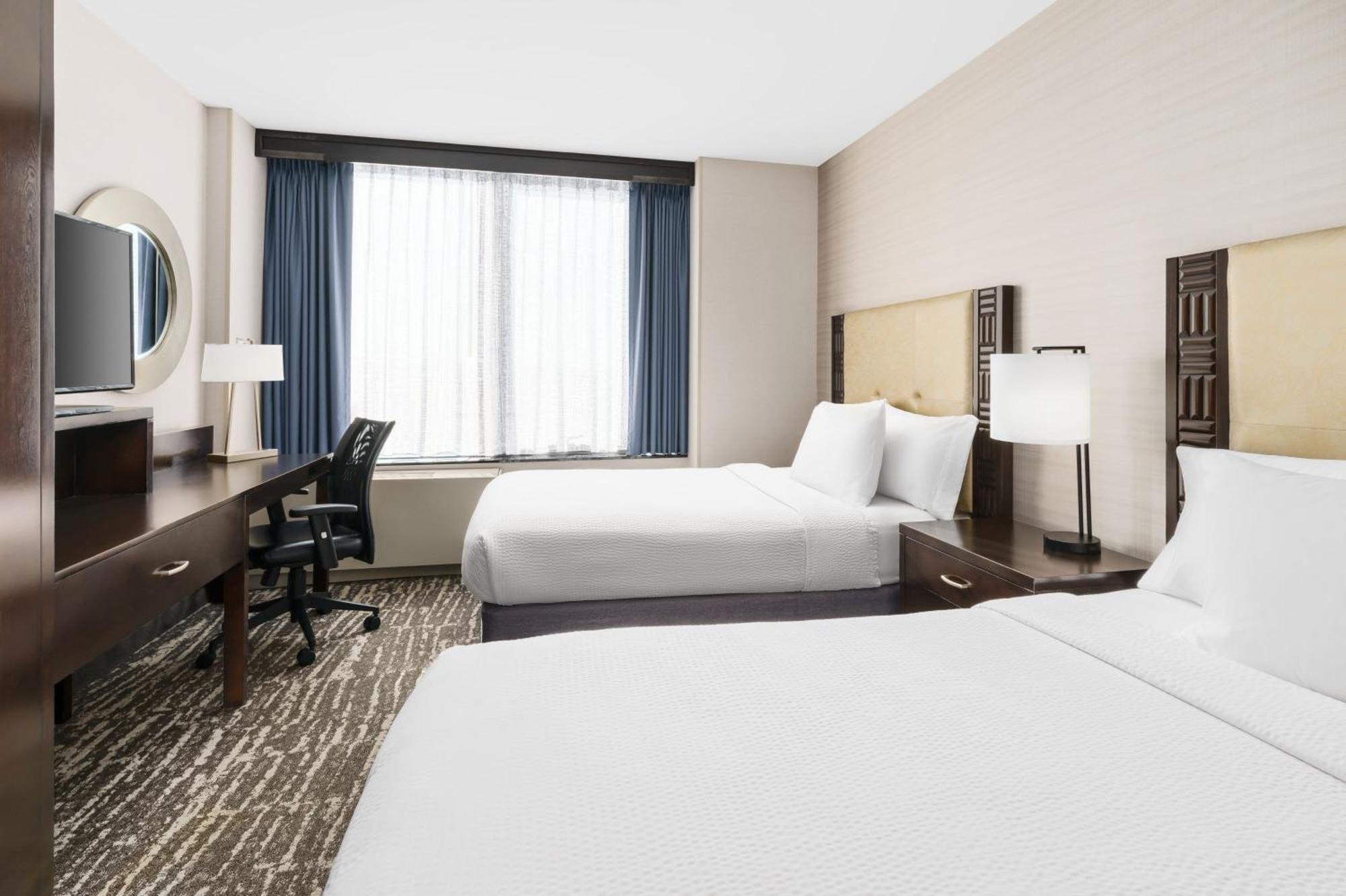 Room Two King Beds City View Roll Shower Transfer Shower Mobility Access or Hearing Accessible