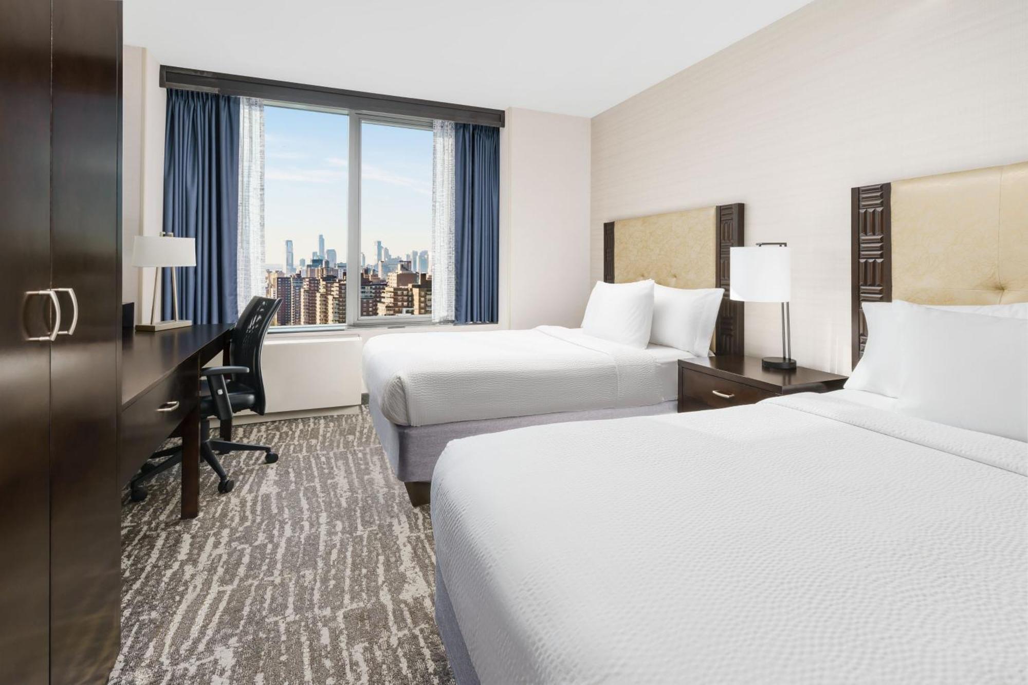 Room Two King Beds City View Roll Shower Transfer Shower Mobility Access or Hearing Accessible