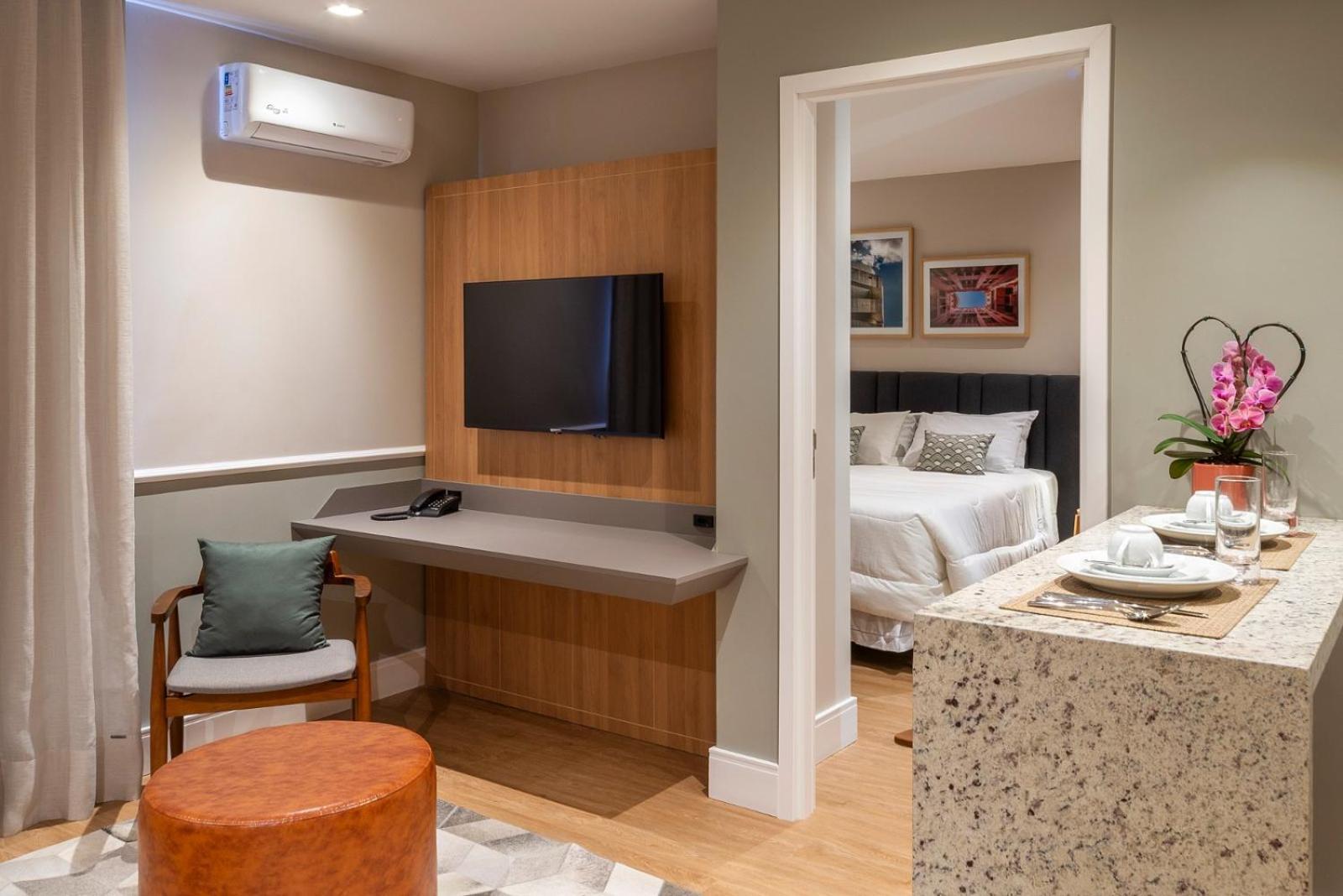 Habitación Executive con cama grande y sofá