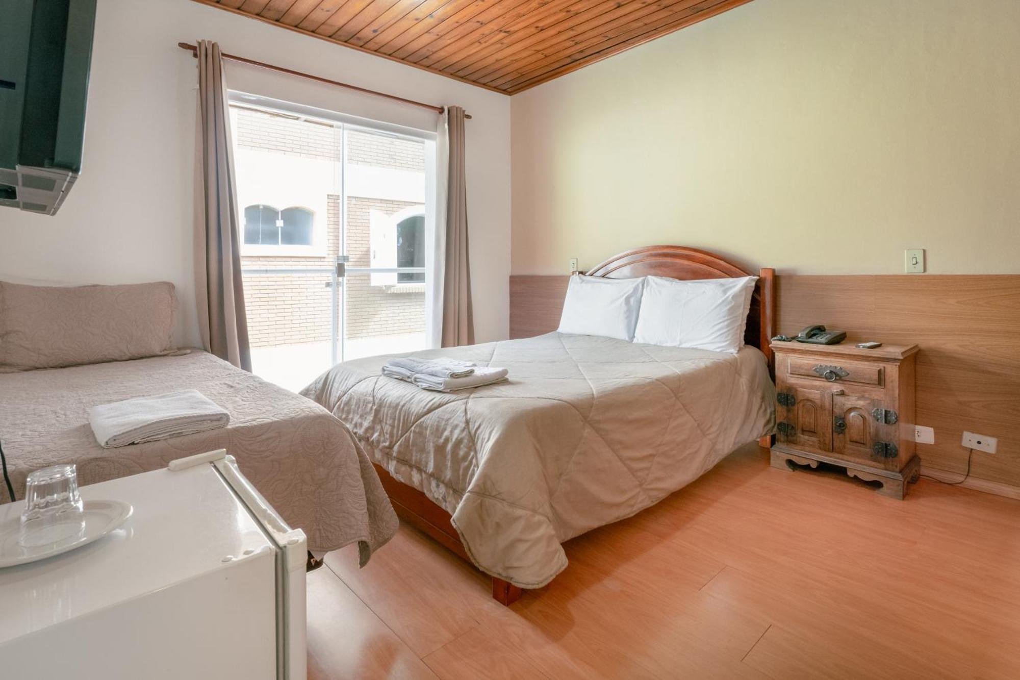 Quarto Triplo com Varanda