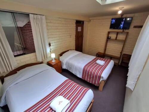 Quarto com 2 Camas de Solteiro