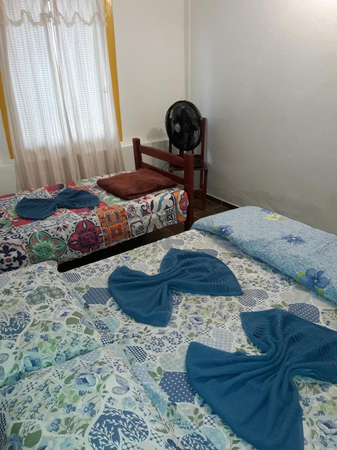 Quarto Triplo com Banheiro Compartilhado