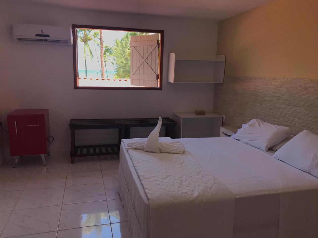 Quarto com Vista Parcial do Mar