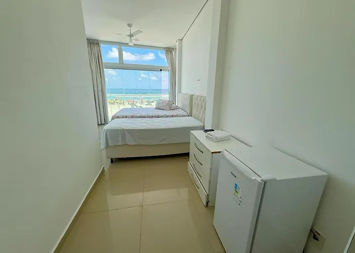 Suites Pitangueiras - Pousada Frente Mar Guarujá